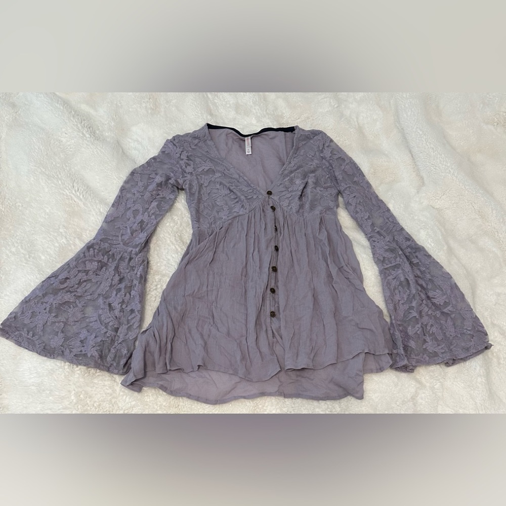 Women’s lavender long sleeved shirt, with lace detail, and size small.
